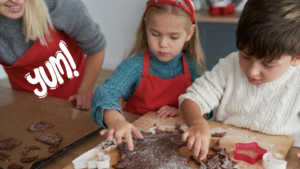 Children baking chocolate recipes together in a kitchen to celebrate World Chocolate Day.